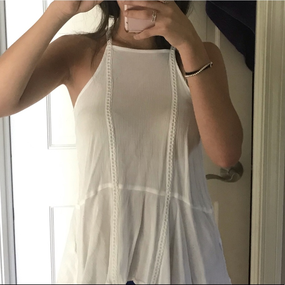 White halter top with trimming down the middle.